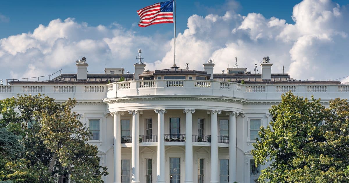 The White House with U.S. flag during Trump’s second term.