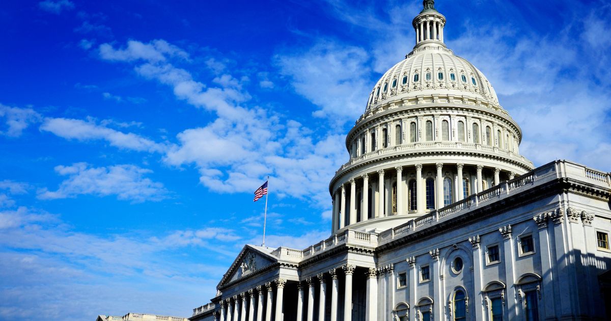 U.S. Capitol Building under blue sky during 2025 tax reform legislation.