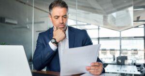 Ultra-high-net-worth investor reviewing portfolio allocation documents