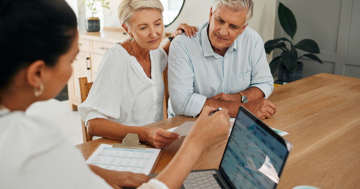 Couple reviewing inherited IRA distribution strategy with financial advisor